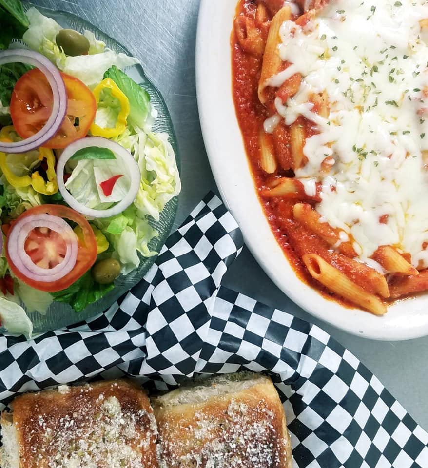Baked pasta, garden salad, and a toasted roll
