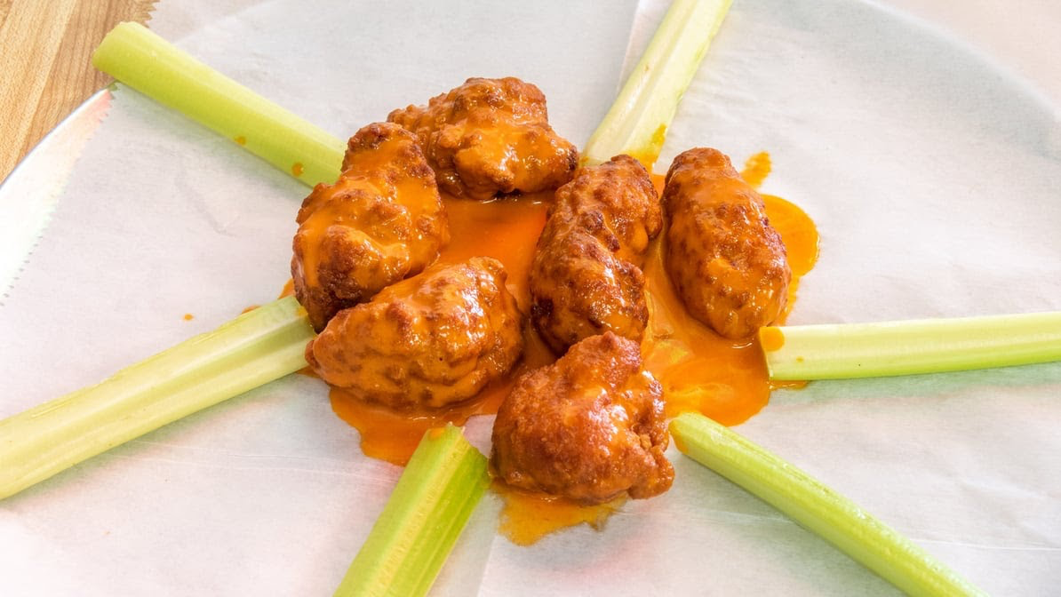 Buffalo wings served with celery